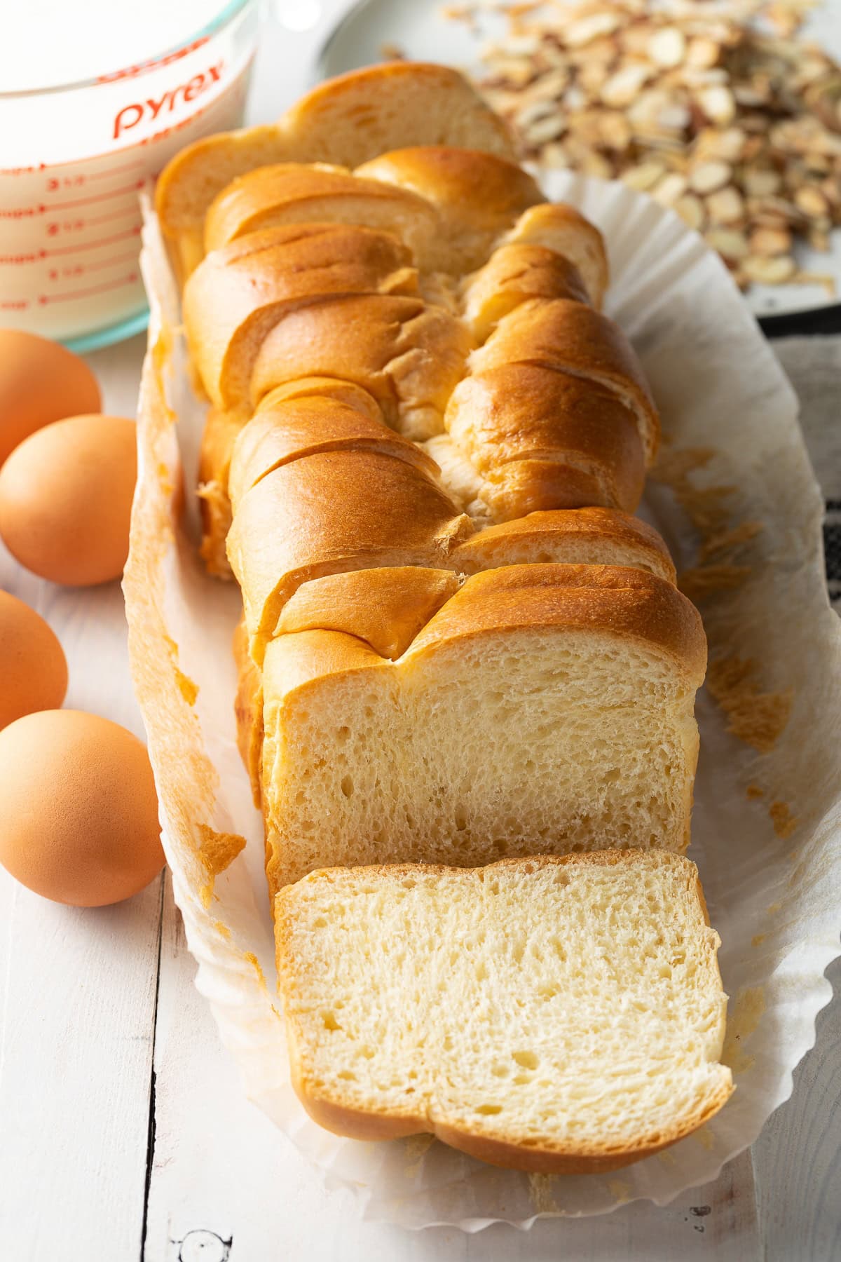 Loaf of brioche sliced into thick slices. 