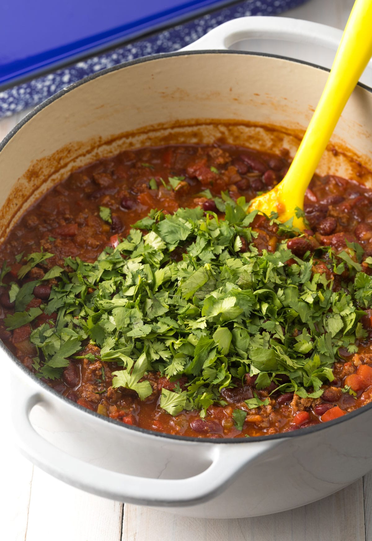 Cowboy Chili cooked in pot with cilantro stirred in at the end