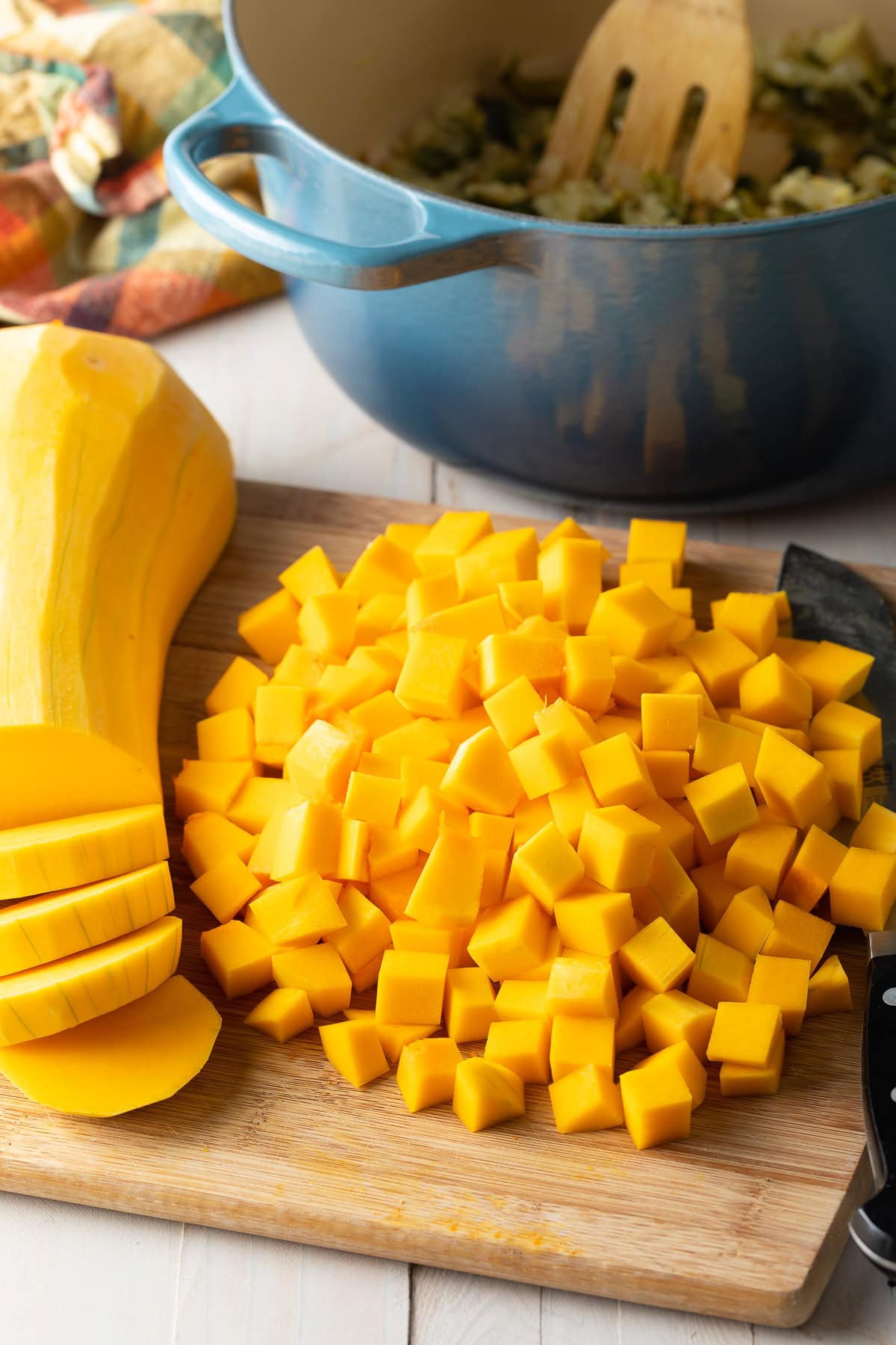 Chopped butternut squash on a cutting board.