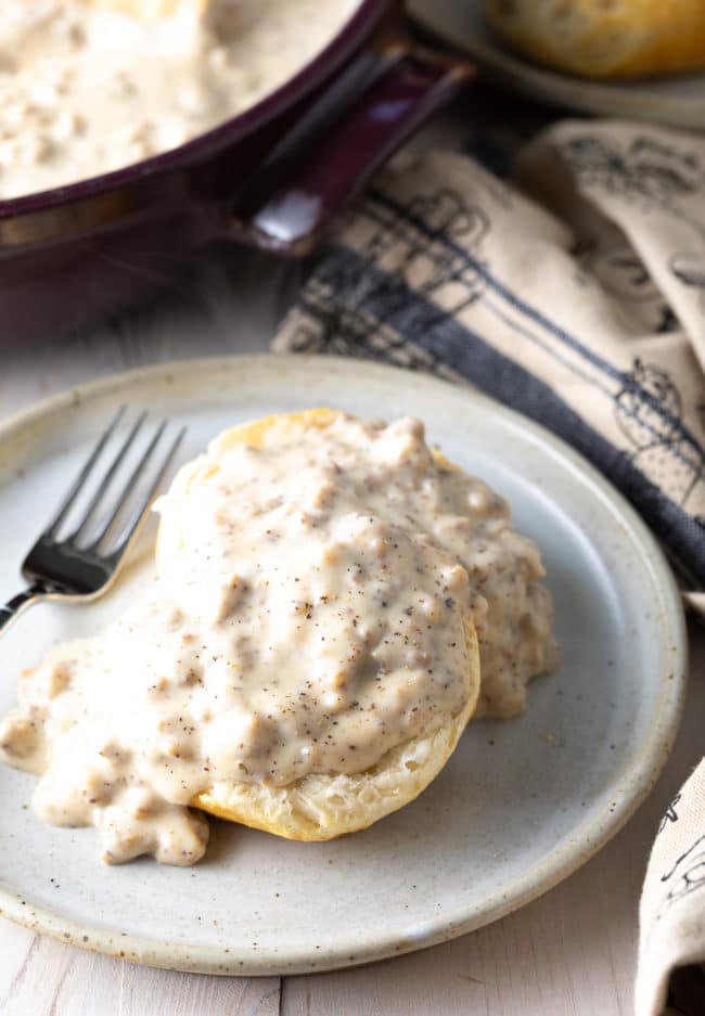 fluffy cathead biscuits covered in white gravy