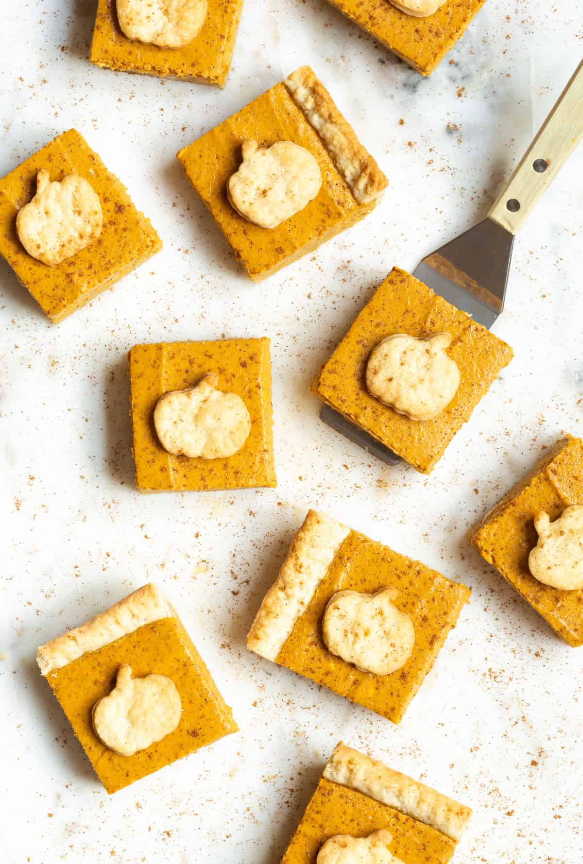 pumpkin pie bars with pastry pumpkins on top