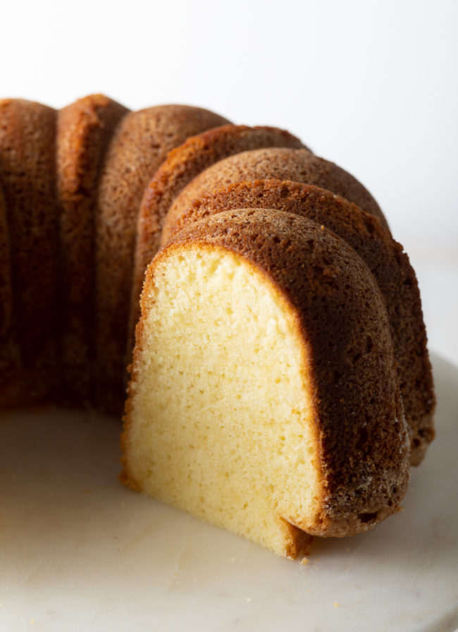 Half sliced cake with the fluffy texture shown on the inside 
