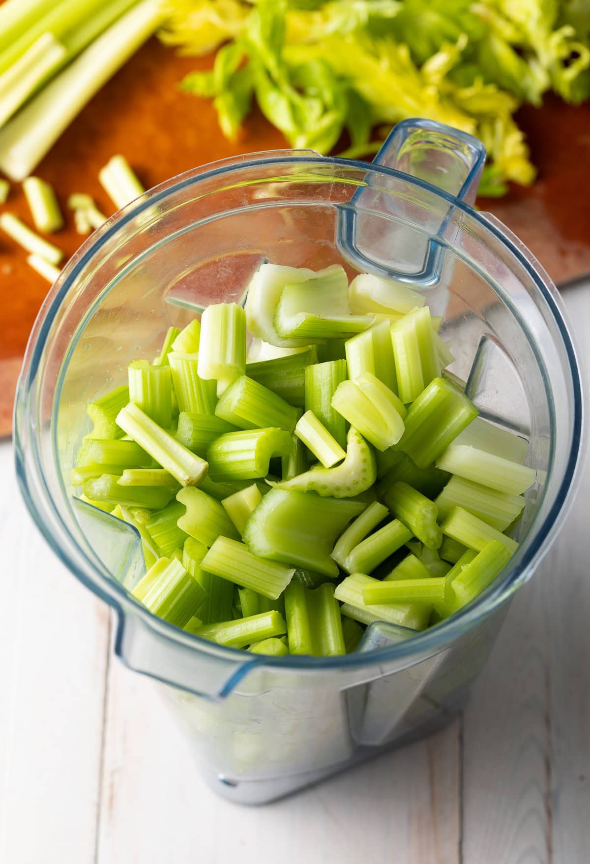 Chopped celery in a blender.