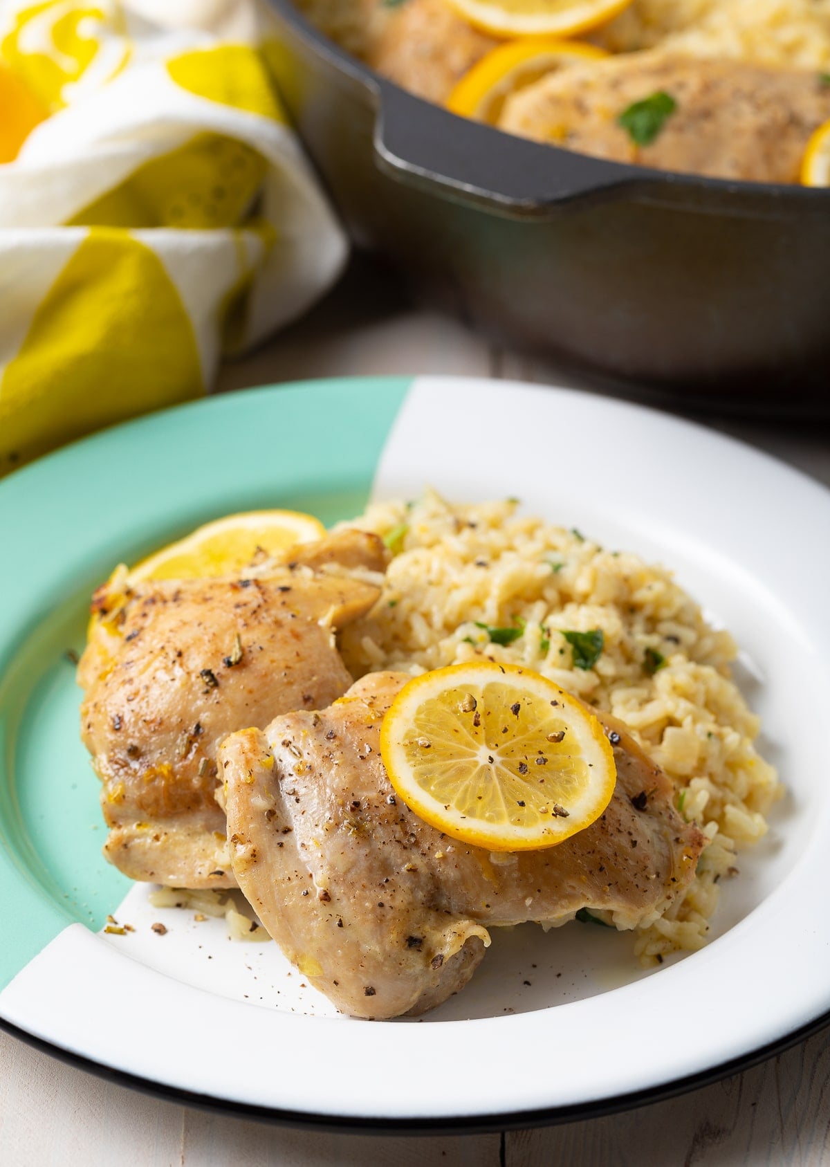 Plate filled with lemon parmesan chicken and rice.