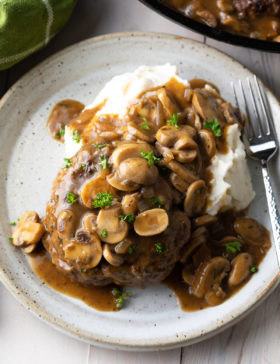 Texas Chopped Steak with Mushroom Gravy Recipe #ASpicyPerspective #steak #beef #burgers #gravy #mushrooms #texas