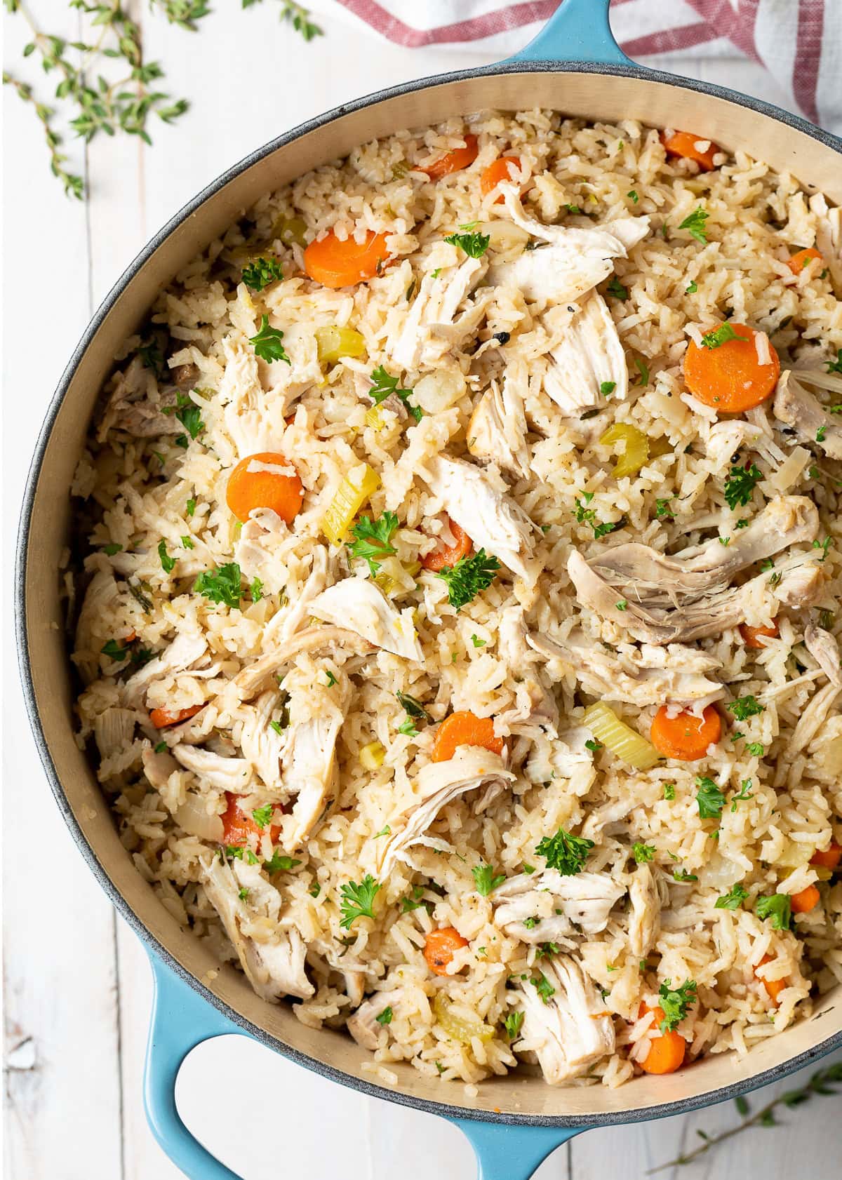 Overhead view of chicken and rice in a pot. 