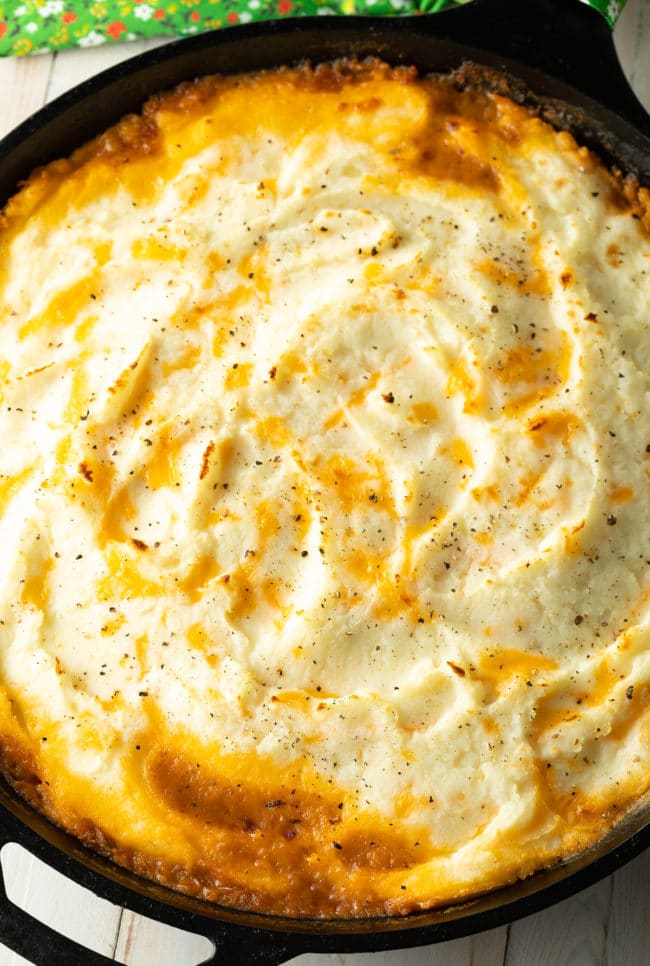 baked cottage pie with crispy potato top, hot out of the oven