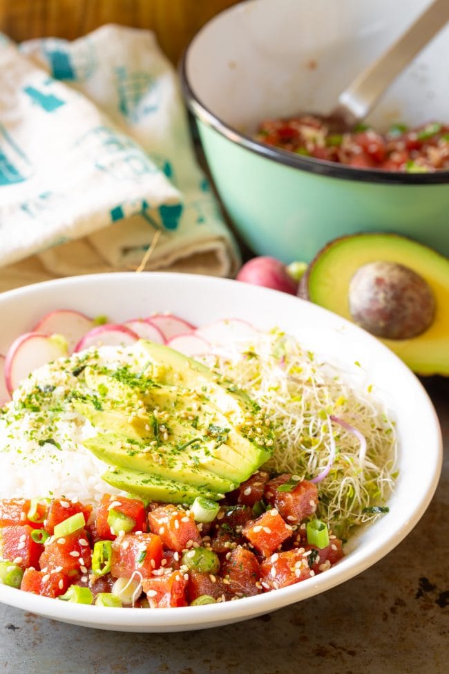 Side view of plated ahi tuna poke in a bowl. 