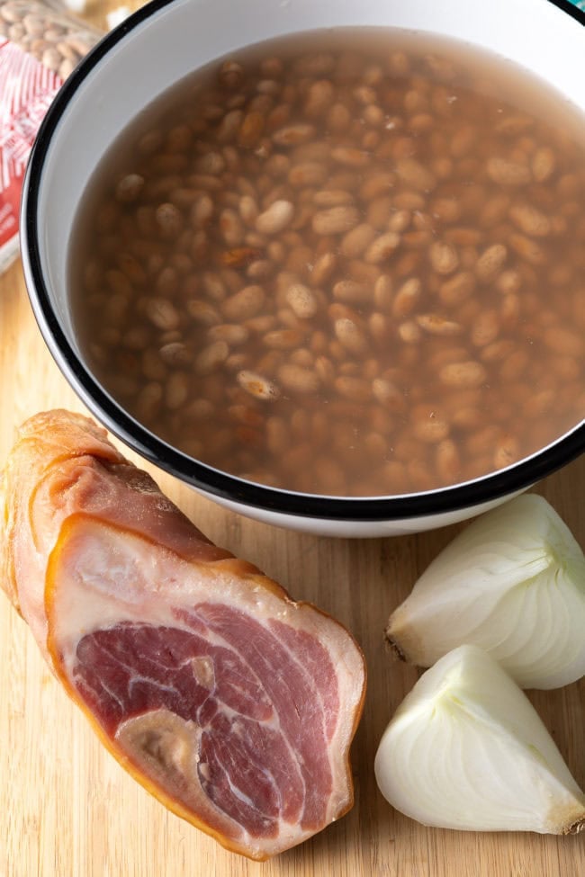 Ingredients for Mexican Pinto Beans on a cutting board.