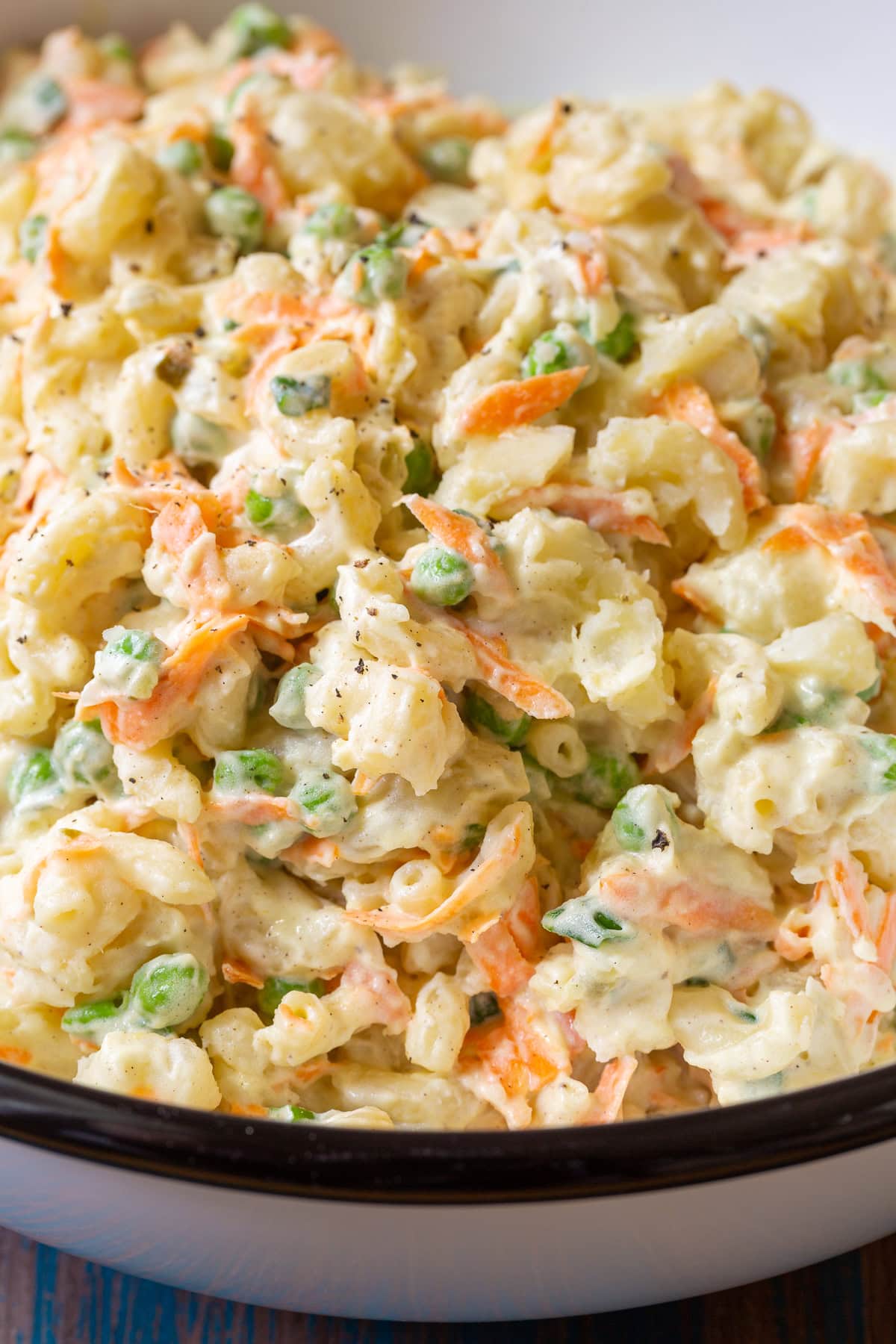 Macaroni salad in a large serving bowl. 