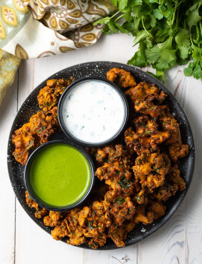 vegetable pakora with Indian green chutney and raita sauce