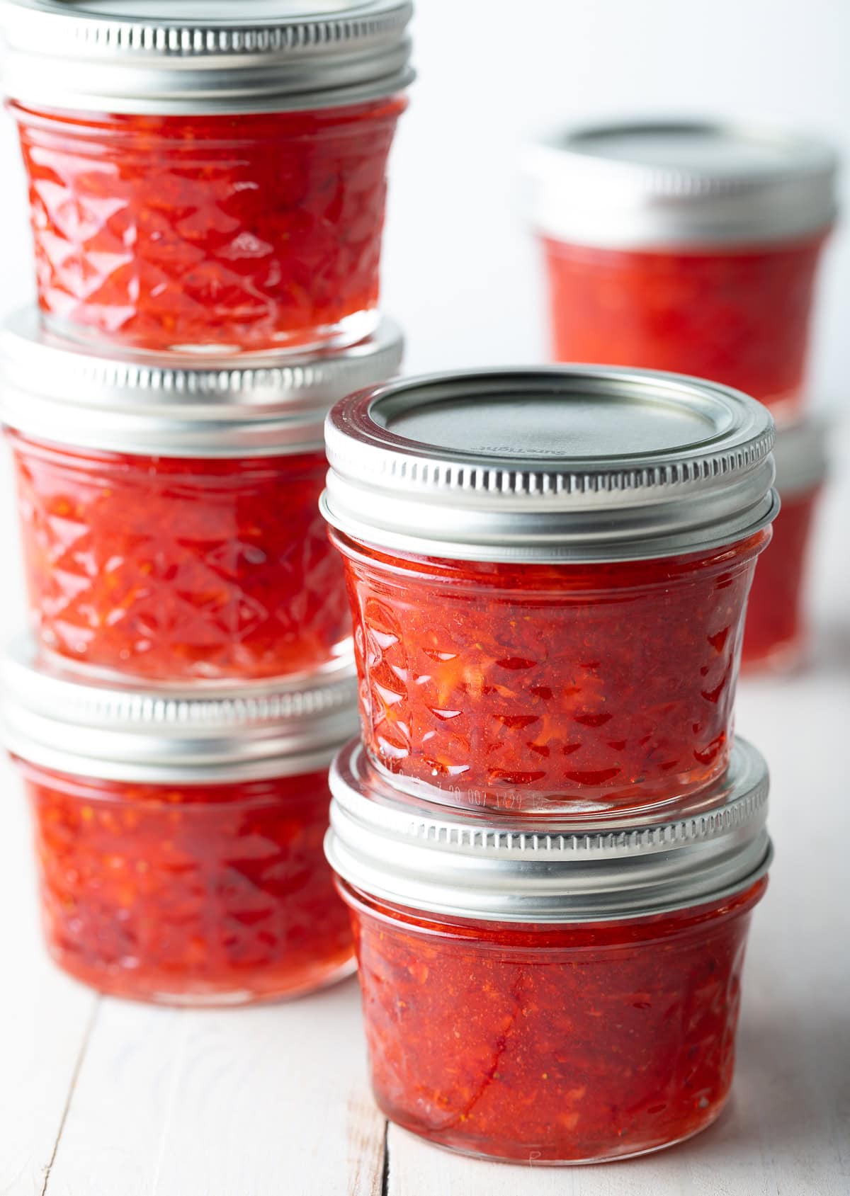Stacks of jars filled with jam. 