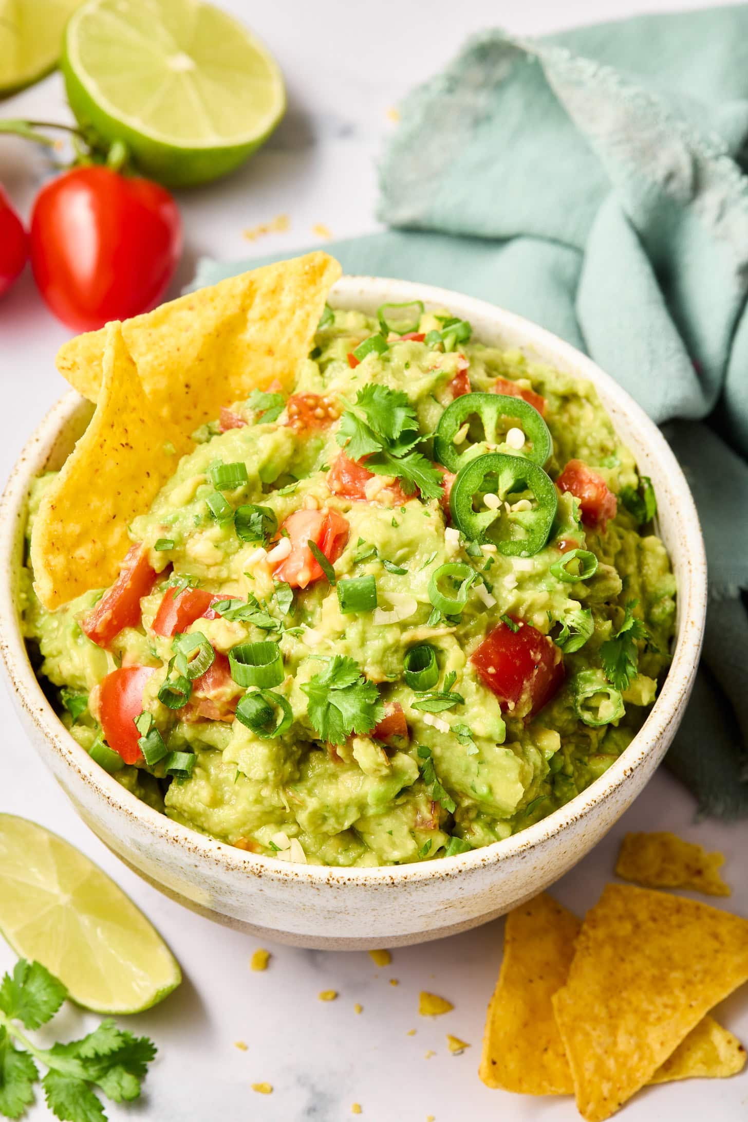 Plated guacamole with a side of chips. 