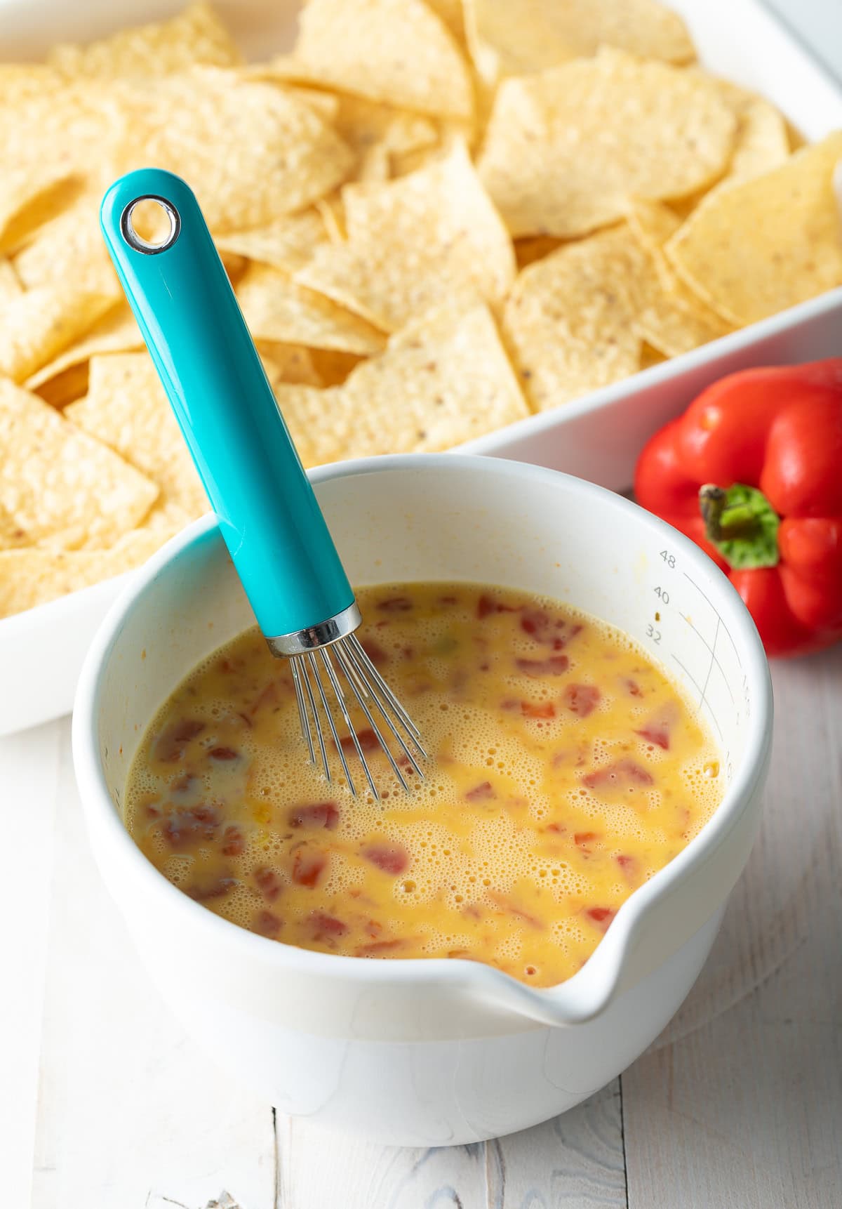 Bowl filled with egg mixture. 