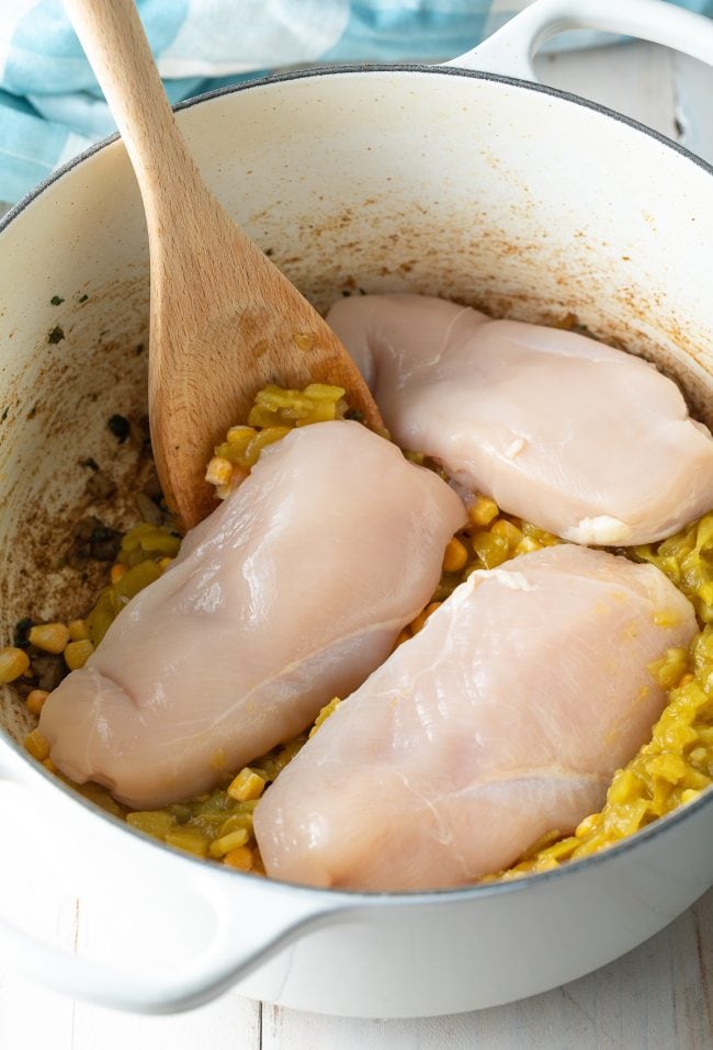 whole raw chicken breasts added to chili pot