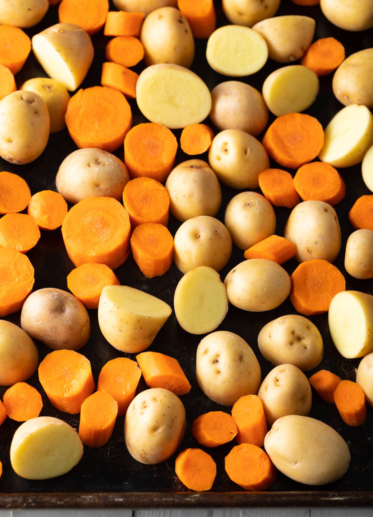 Top down view of chopped potatoes and carrots.