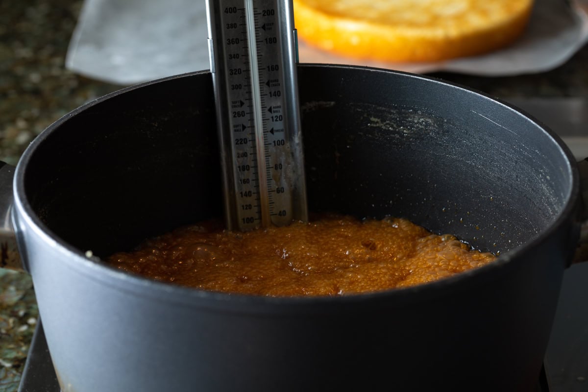 Caramel frosting mixture boiling in a pot. 