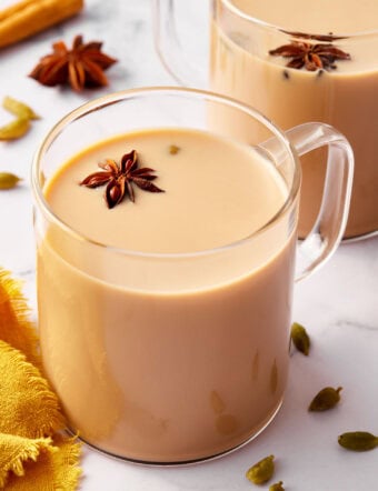 Graphic with text how to make Indian chai tea with photo of tea in a clear mug.