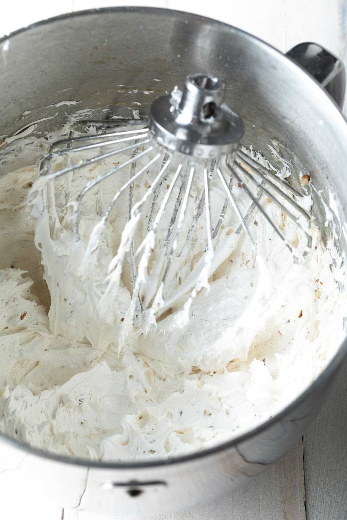 Nougat mixture being mixed in an electric mixer.