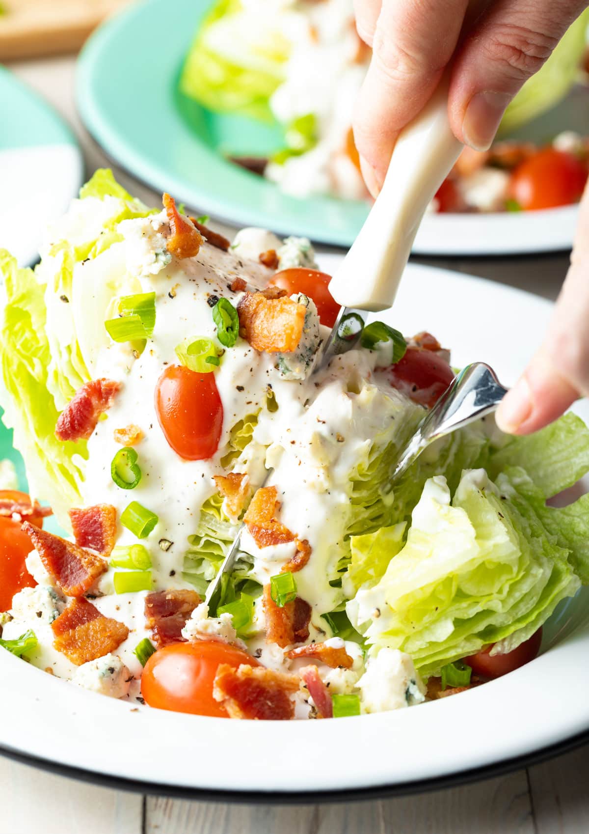 iceberg wedge salad - Blue Cheese Wedge Salad with lots of toppings, cut into pieces