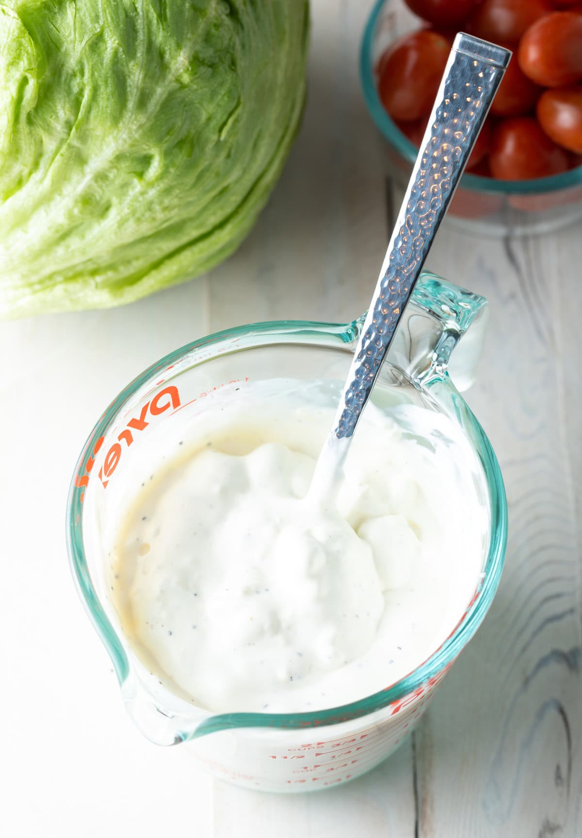 homemade blue cheese dressing mixed in bowl with spoon