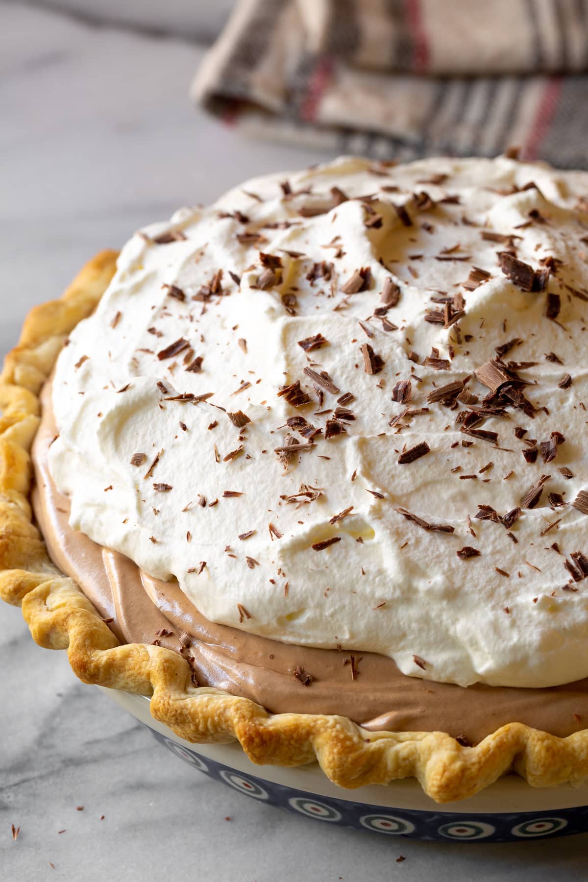 Closeup of pie topped off with chocolate shavings. 