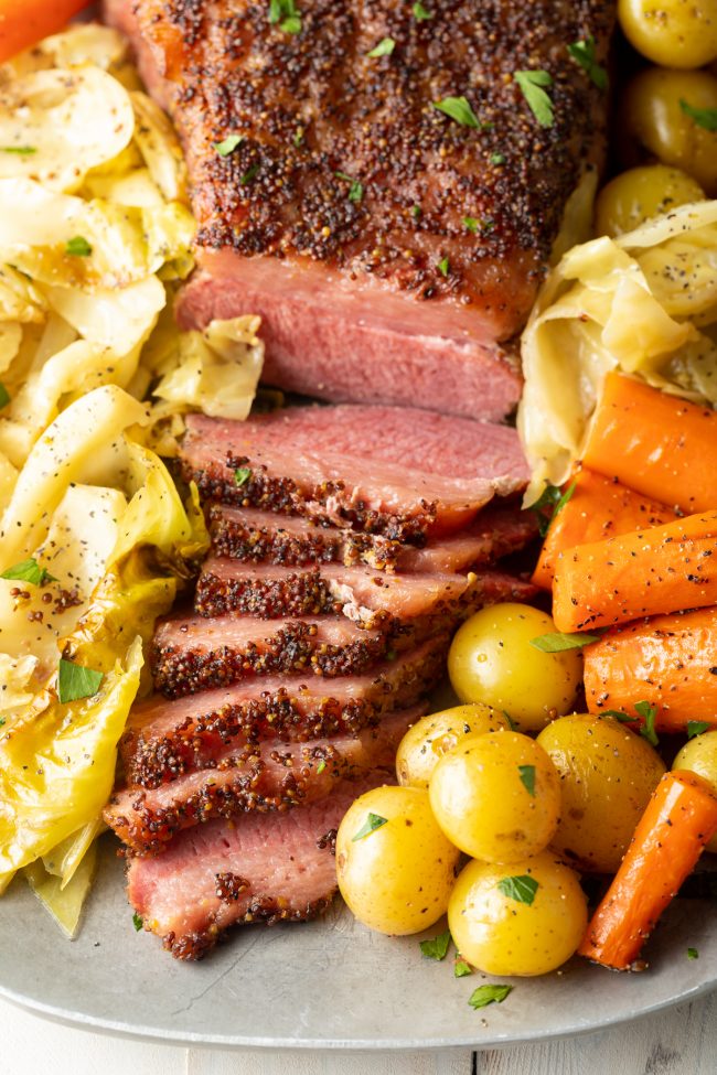 close up of oven baked corned beef and cabbage on a platter