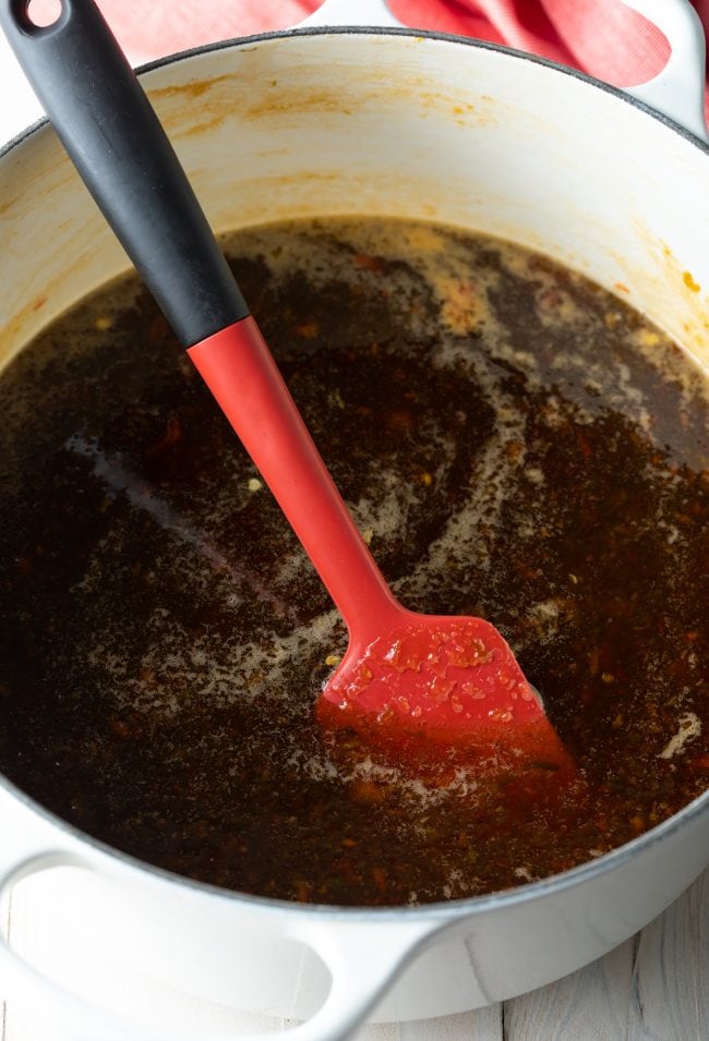 Spatula blending pectin and pepper blend. 