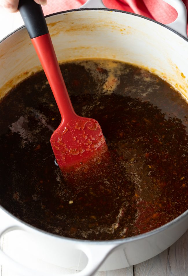 stirring homemade jelly