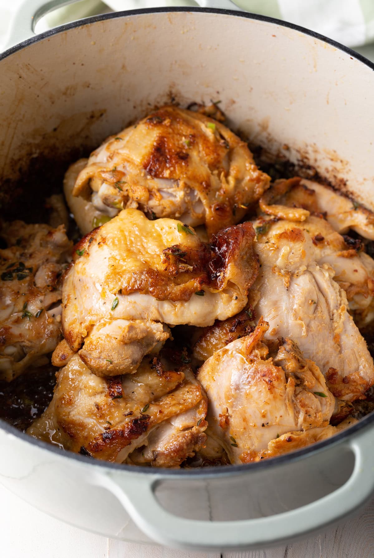 Browned chicken in a pot.