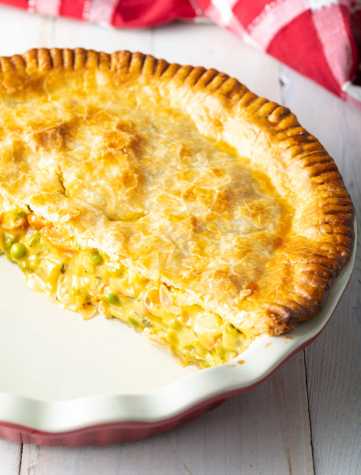 Half of the cooked veggie pot pie in the baking dish.