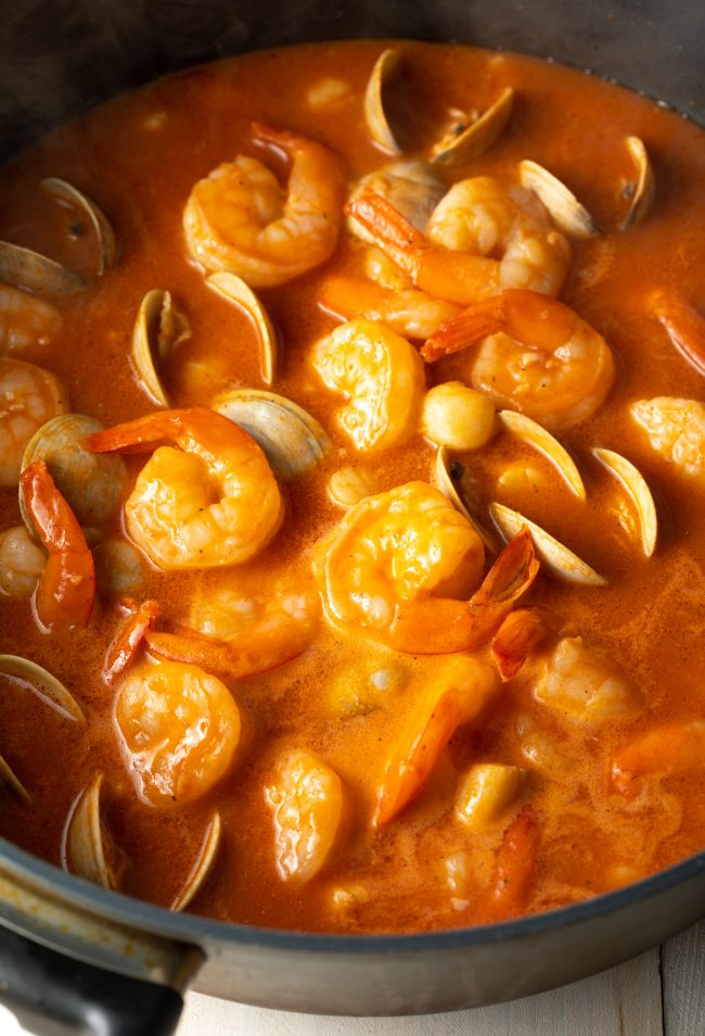 scallops, shrimp, and clams in tomato and wine