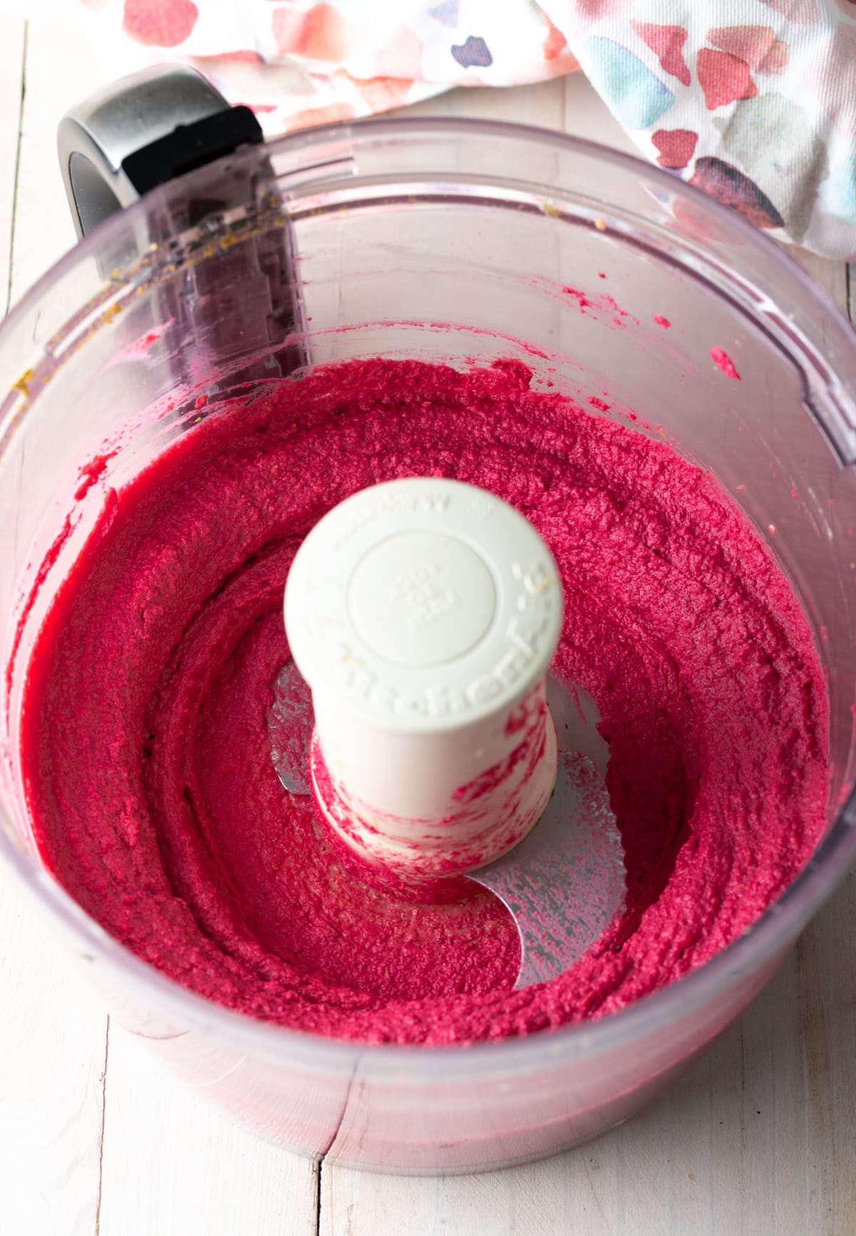 Overhead shot of pureed beet dip in blender.
