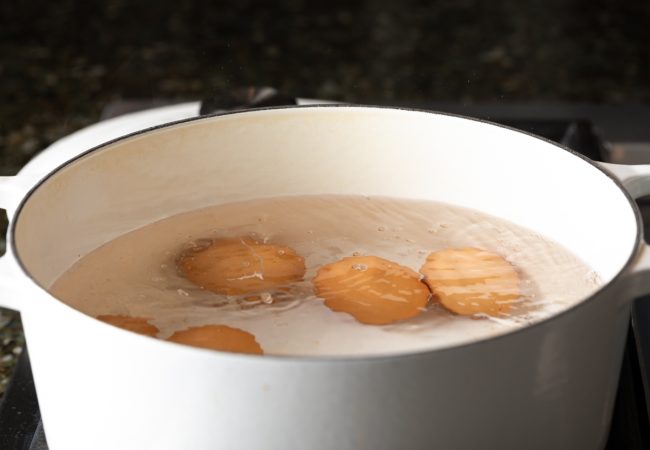 whole eggs boiling in water