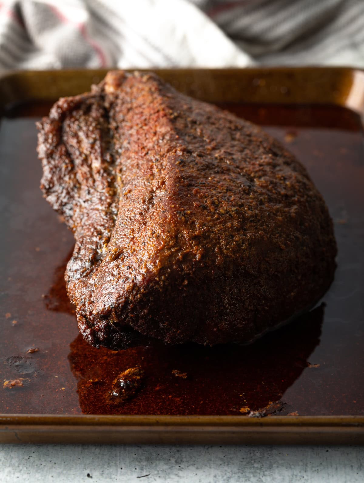 Smoked beef on a baking sheet.