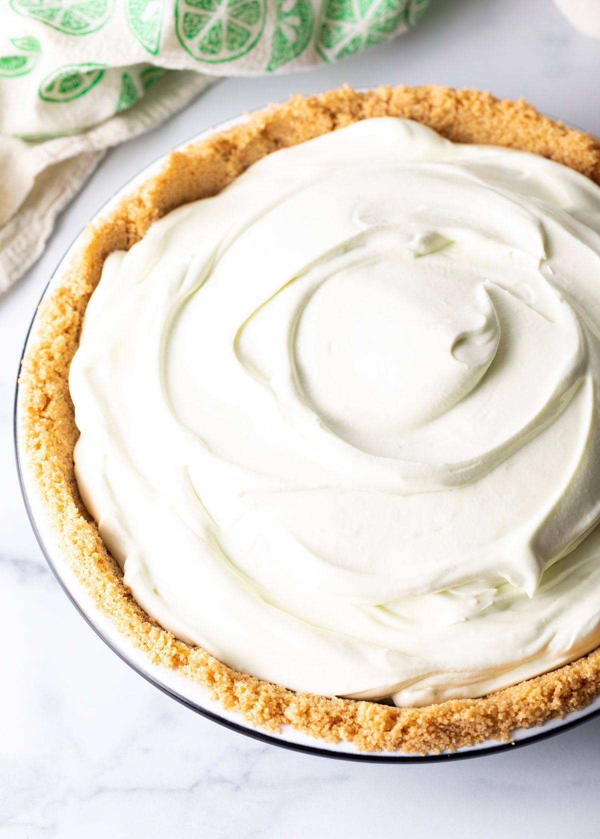 Key lime filling on top of graham cracker crust.