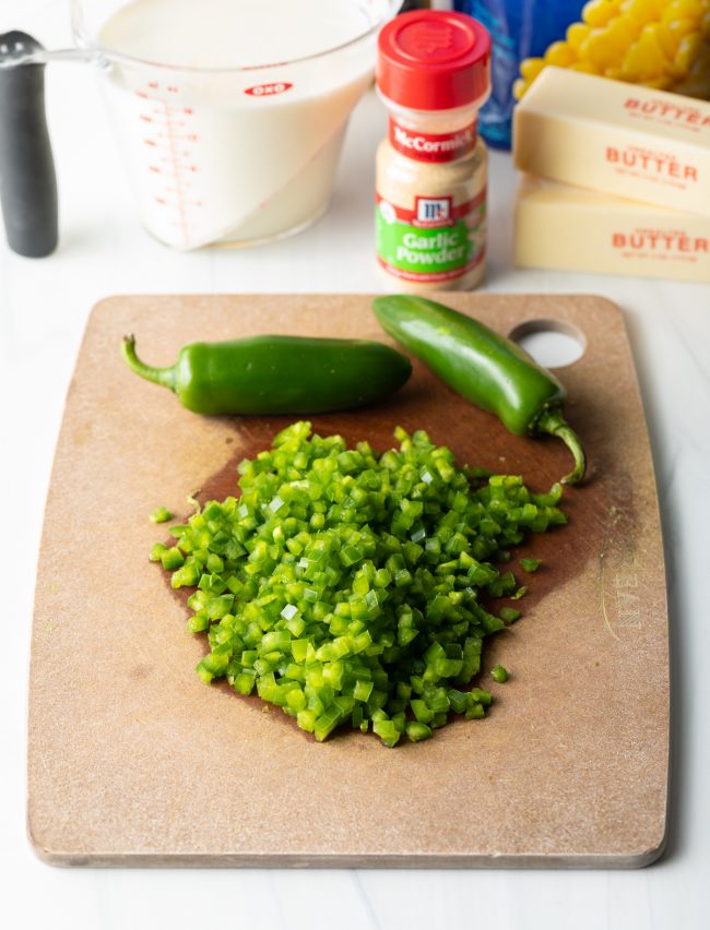chopped jalapenos on a cutting board