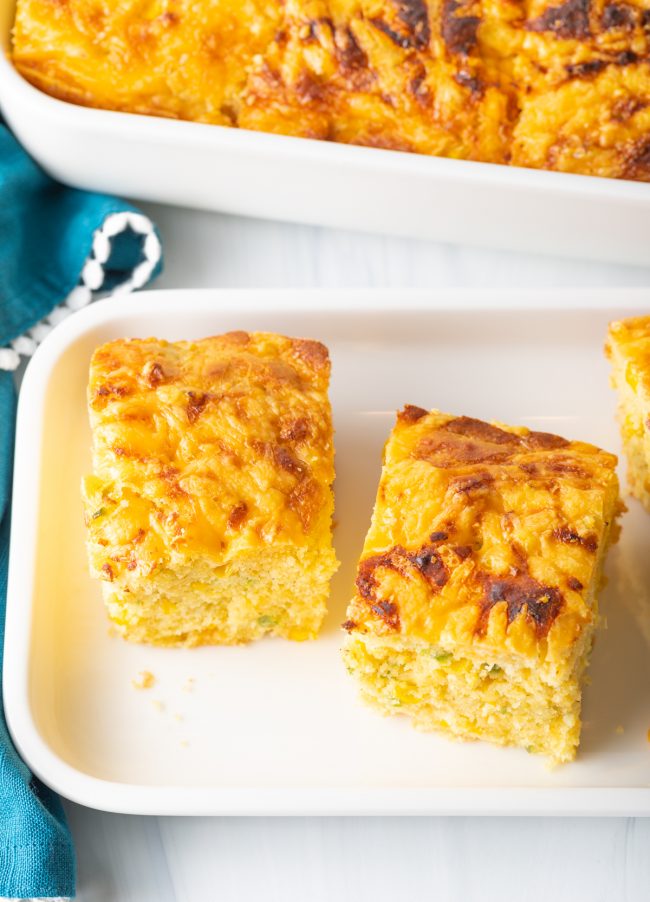 overhead view squares of baked cornbread with cheese and jalapenos
