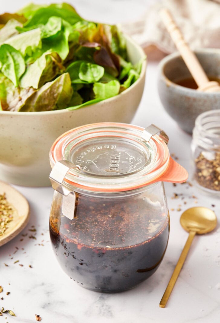 how to make balsamic dressing - close up of ingredients in jar