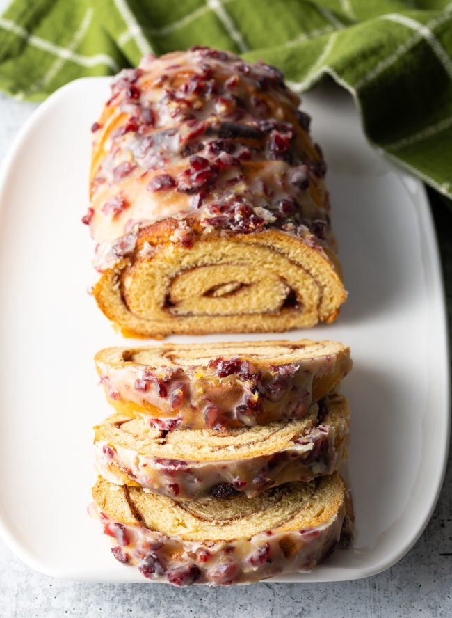 top down view cinnamon swirl loaf with cranberry lemon glaze