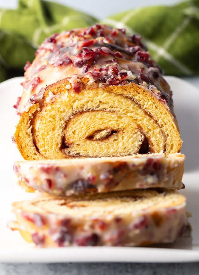 close view of Christmas swirl bread sliced on a plate