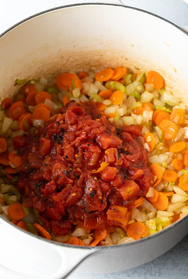 large pot with cooked carrots, onions, and tomatoes