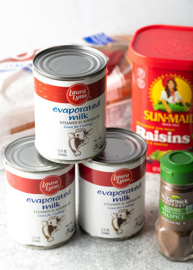 evaporated milk, container of raisins, and bottle of allspices
