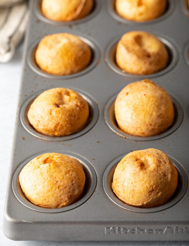 up close view of Brazilian cheese bread in a muffin tin
