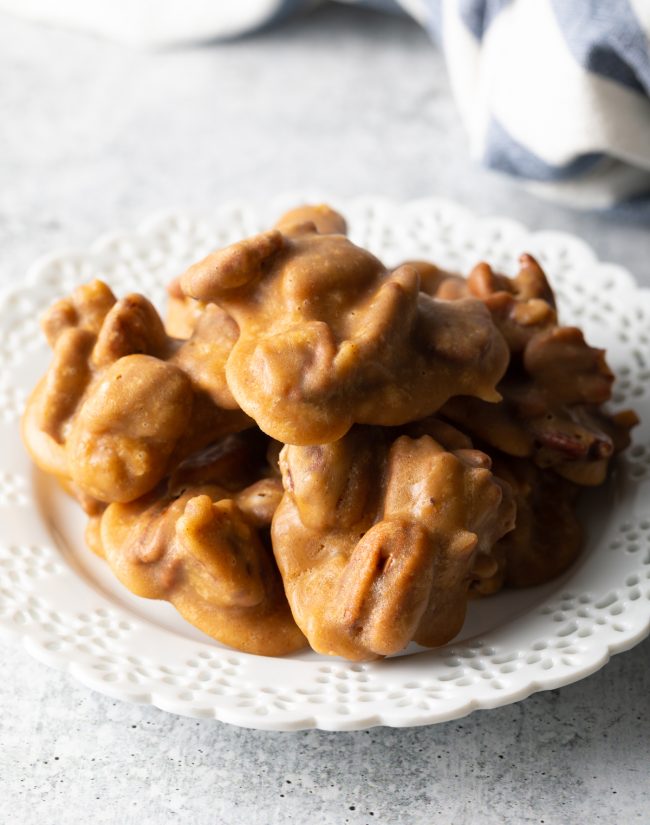 top view of several pecan pralines on a white plate