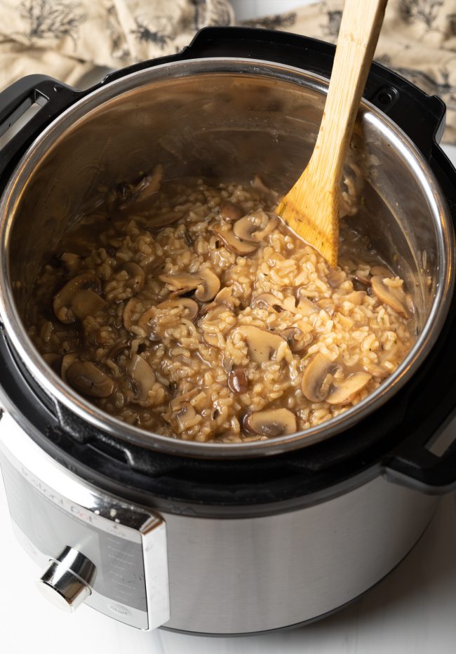 top view cooked rice with mushrooms in the pressure cooker