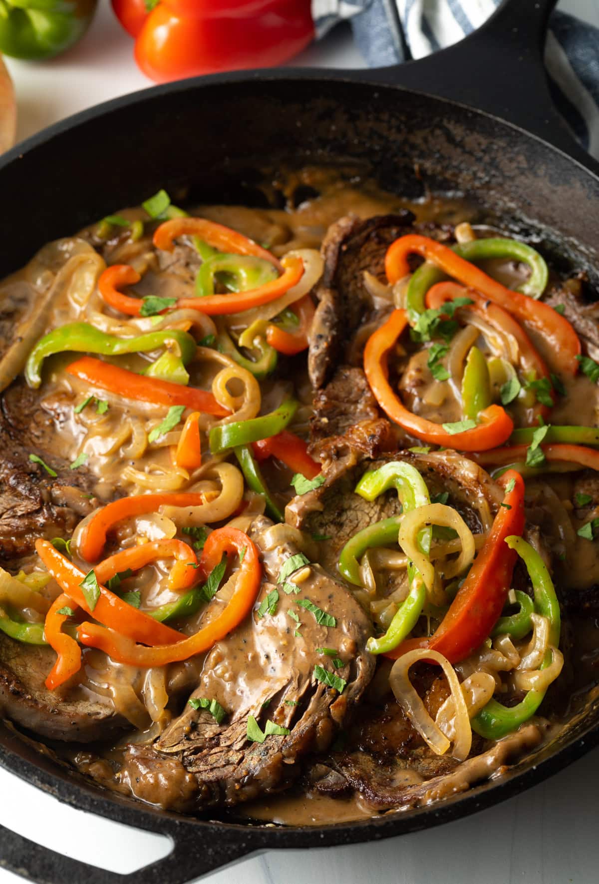 top view of seared beef with veggies in a cast iron