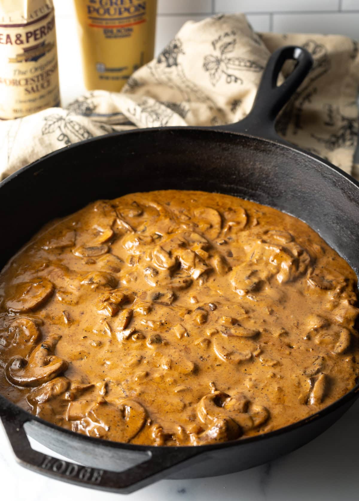 Mushroom and cognac cream gravy in a cast iron skillet.