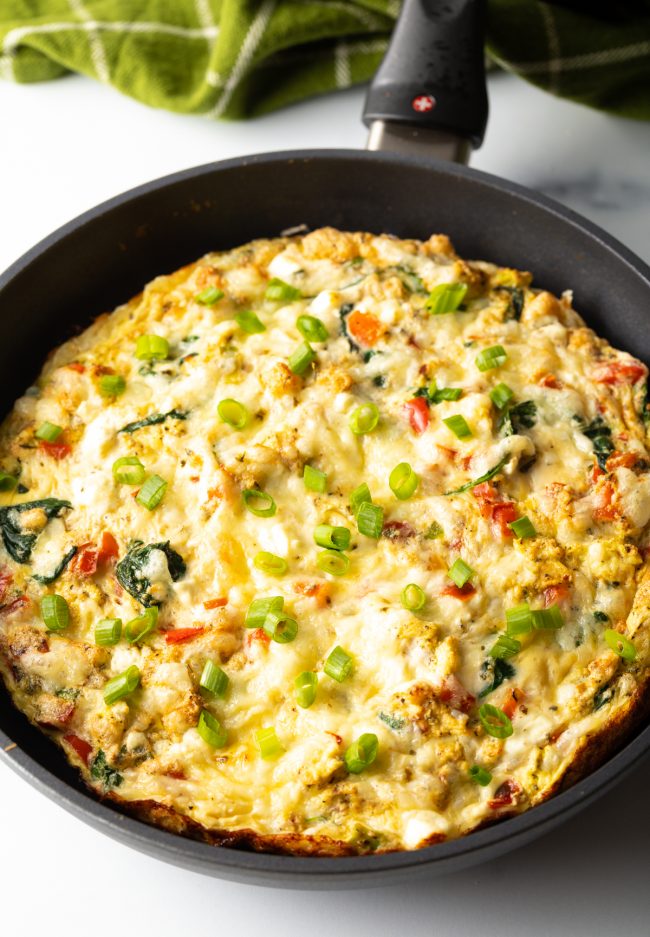 baked egg white and peppers frittata in a cast iron skillet