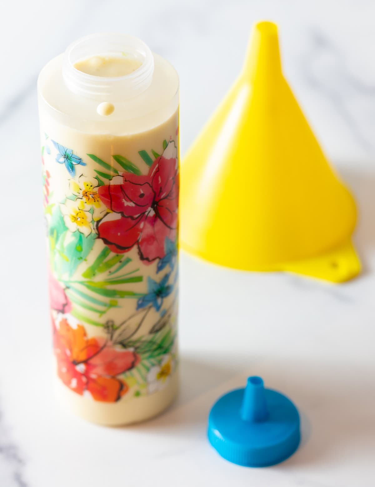 Funnel cake batter is in a plastic squirt bottle for easy pouring.